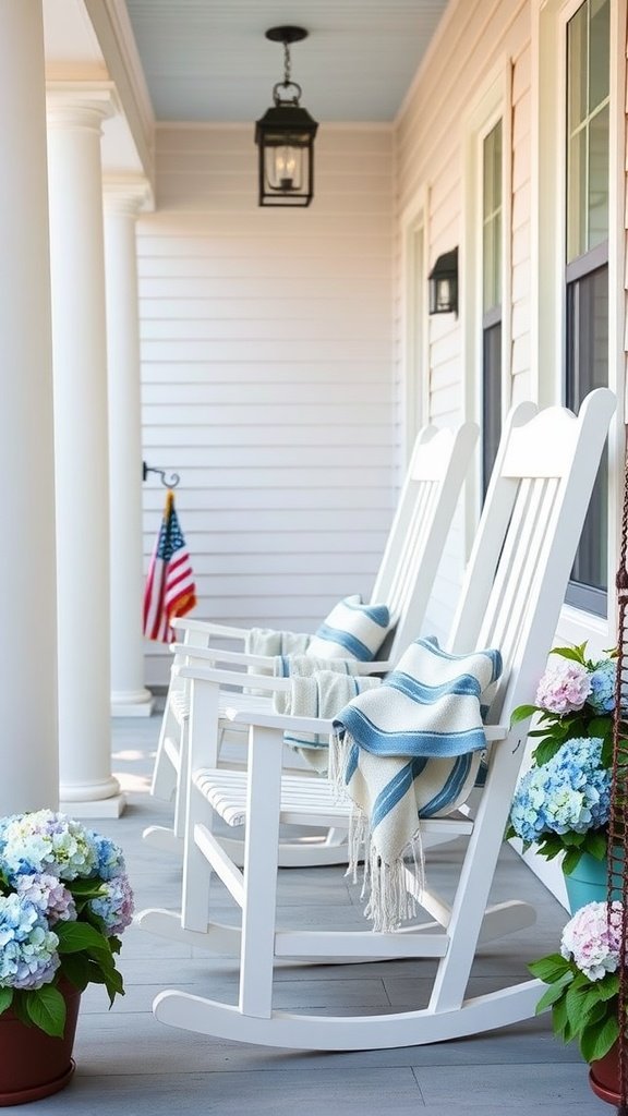 A cozy porch featuring white rocking chairs with blue striped cushions, surrounded by colorful hydrangeas and a warm lantern.